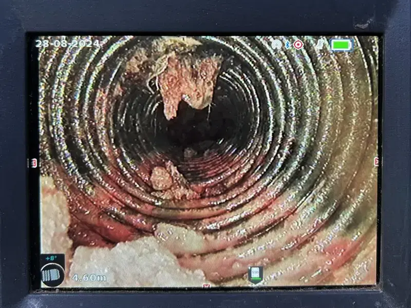 CCTV monitor showing pipe condition during pre-purchase inspection
